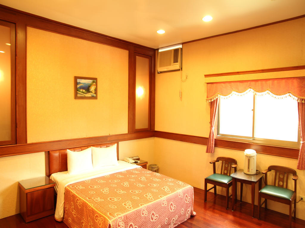 Fukun 5 Motel Джиаоси Стая снимка